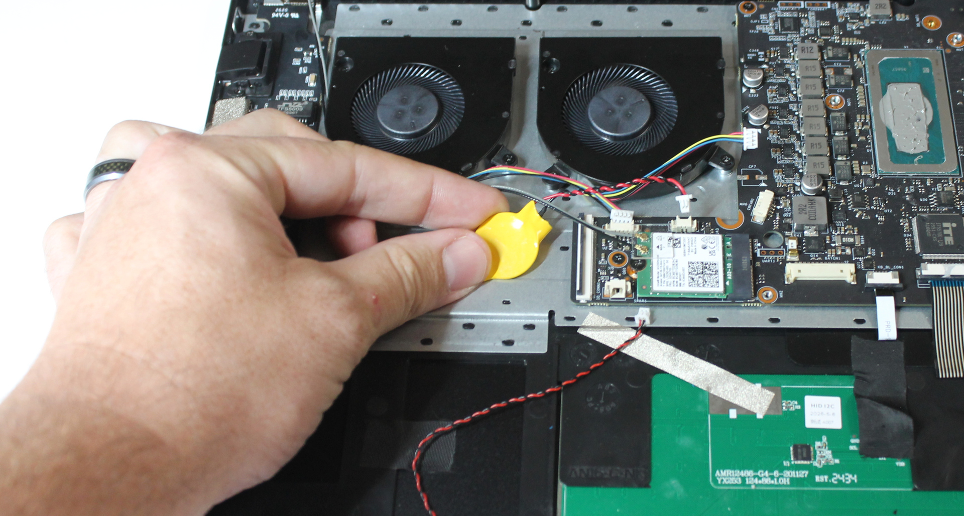 Coin cell in chassis showing removal