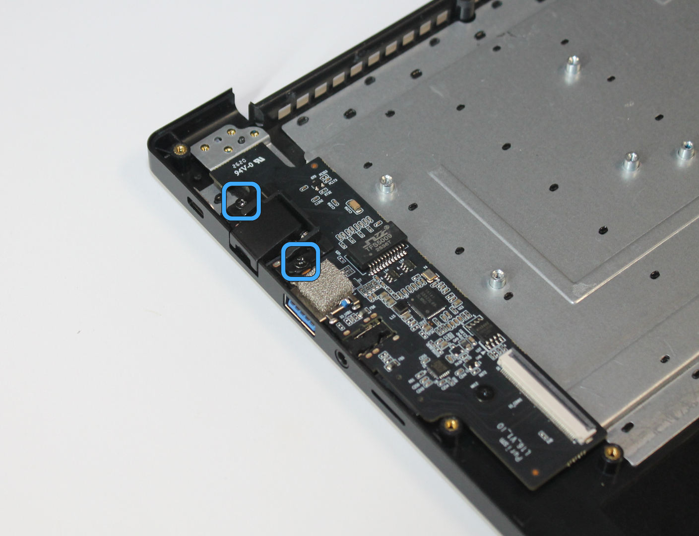 Ethernet cover with screw locations marked