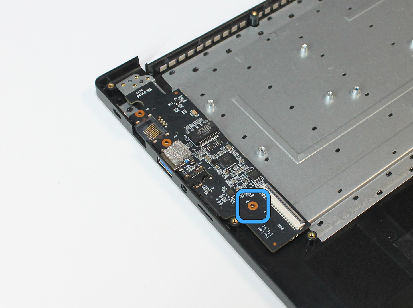 I/O board with screw location marked