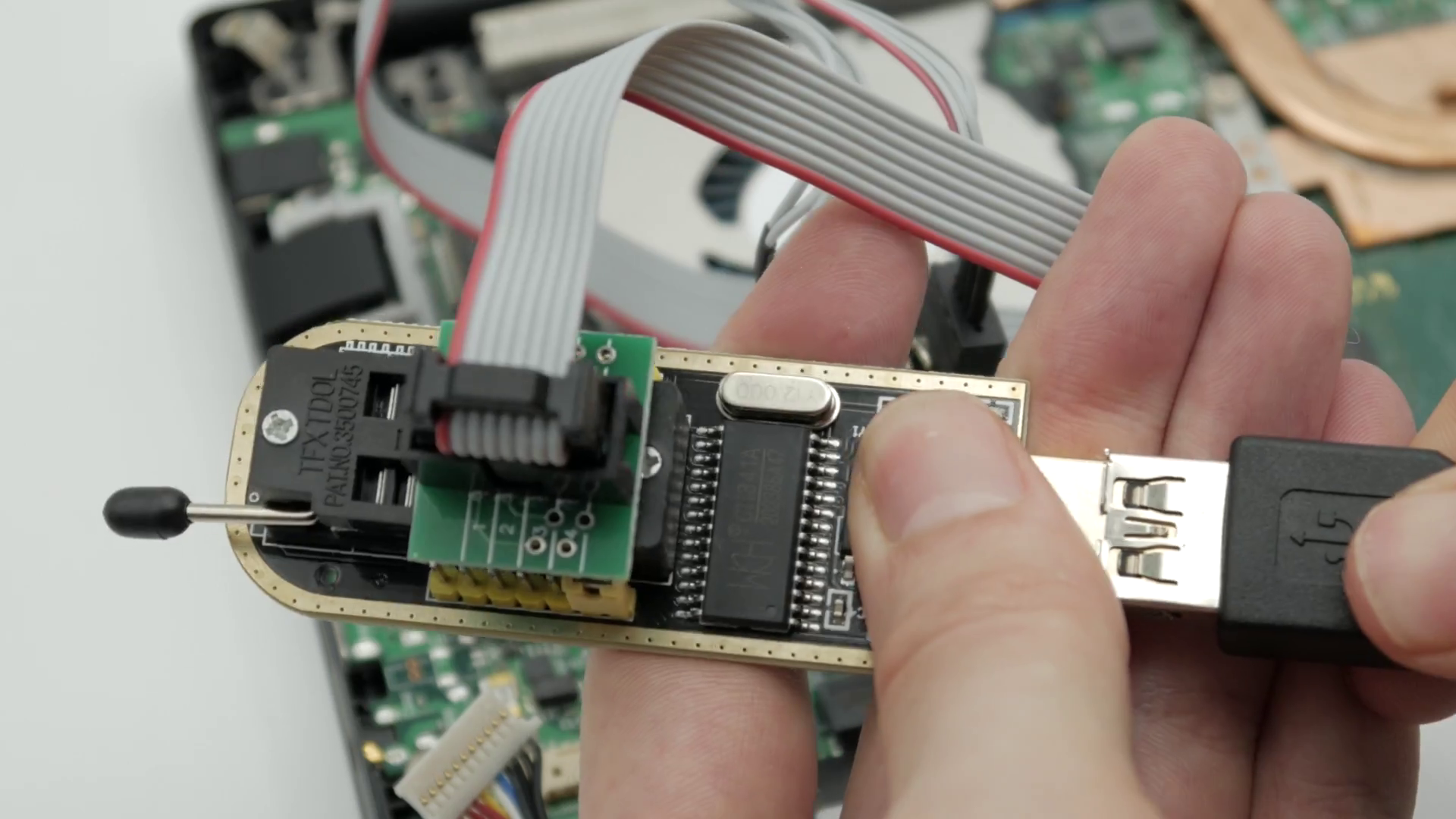 Librem 14 with CH341A programmer connected to a computer with a USB cable